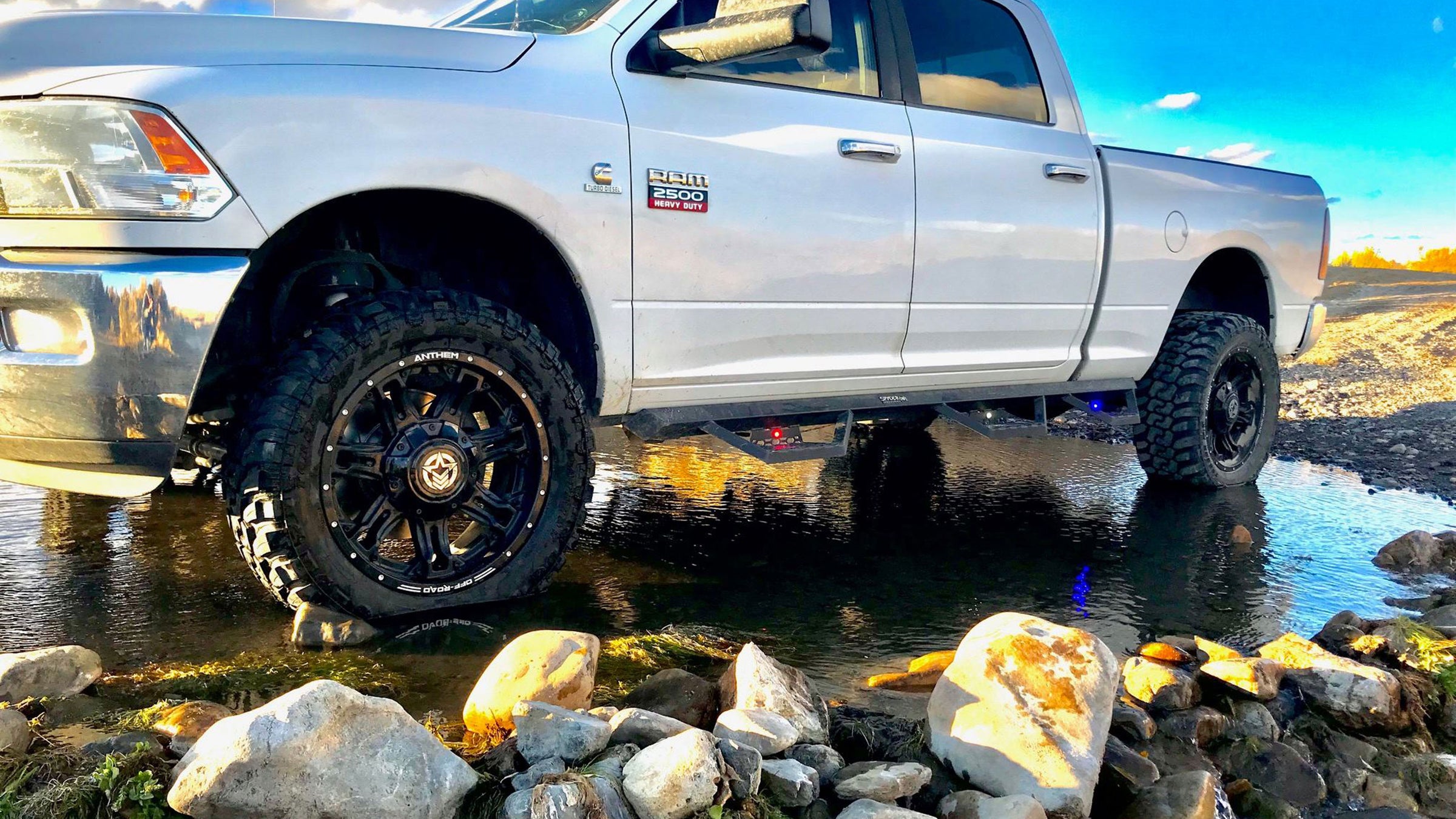 Spyder Industries S/I Triple Steps with lights installed on RAM truck