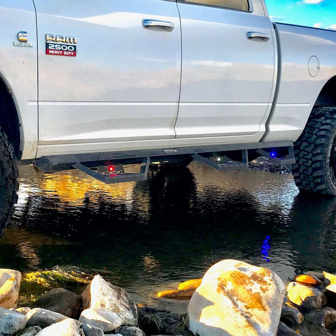 Spyder Industries S/I Triple Steps with lights installed on RAM truck